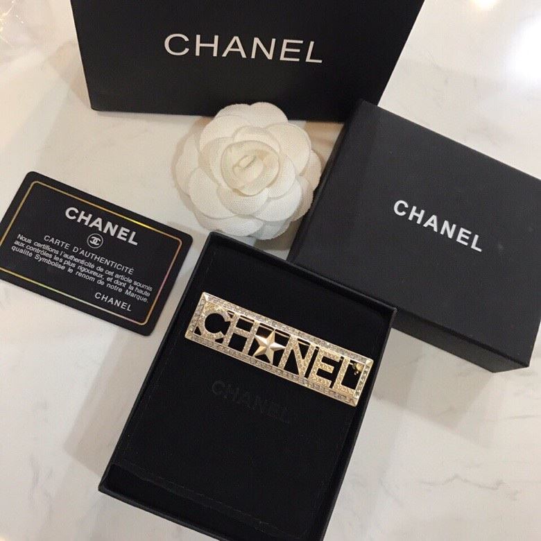 Ch*el brooches